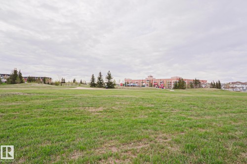 Expansive green space with manicured grass - 1627 Melrose Place Sw, Edmonton, AB - Outdoor With View