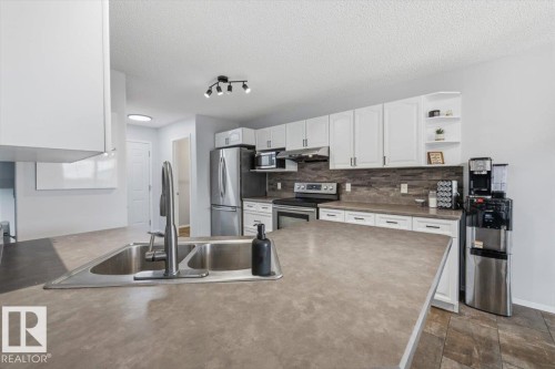 3570 Mclean Crescent, Edmonton, AB - Indoor Photo Showing Kitchen With Double Sink