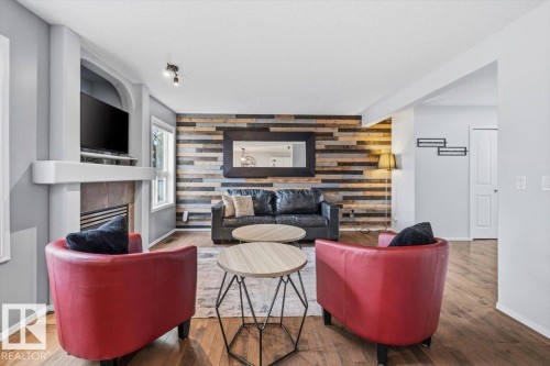 3570 Mclean Crescent, Edmonton, AB - Indoor Photo Showing Living Room With Fireplace