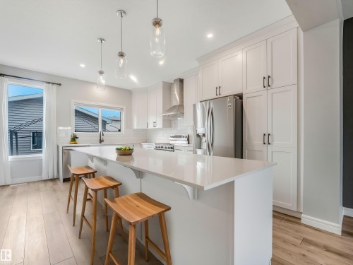 Virtually Staged - 19310 26A Ave, Edmonton, AB - Indoor Photo Showing Kitchen With Stainless Steel Kitchen With Upgraded Kitchen