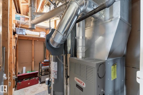 Utility room featuring a Lennox furnace and water heater - 886 Knottwood Road S, Edmonton, AB - Indoor Photo Showing Basement