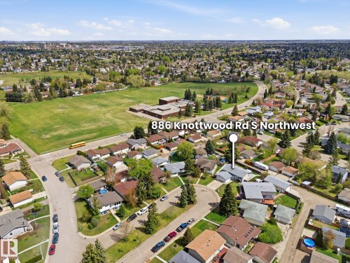 Residential neighborhood featuring a mix of mature trees and established homes - 886 Knottwood Road S, Edmonton, AB - Outdoor With View