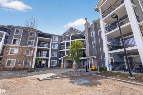 Multi-story building featuring stone veneer and horizontal siding - 215 6084 Stanton Drive, Edmonton, AB - Outdoor With Balcony With Facade