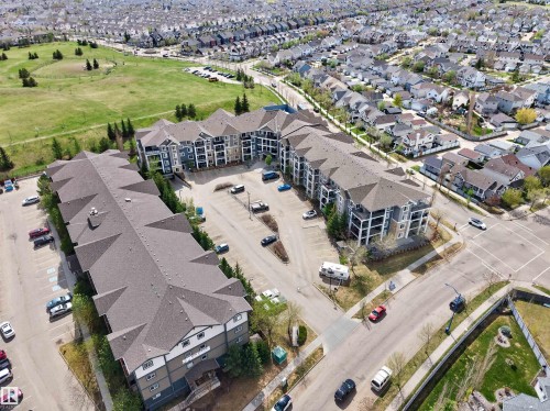 Aerial perspective of multi-story residential buildings featuring gabled roofs and private balconies - 215 6084 Stanton Drive, Edmonton, AB - Outdoor With View