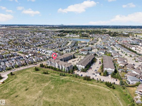 Aerial perspective showcasing a residential community with varied architectural styles - 215 6084 Stanton Drive, Edmonton, AB - Outdoor With View