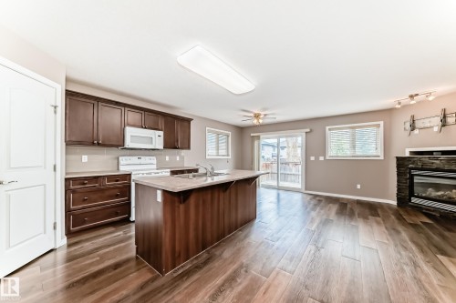 16737 60St, Edmonton, AB - Indoor Photo Showing Kitchen With Fireplace