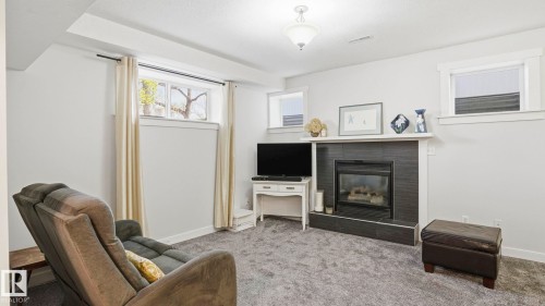 9611 77 Avenue, Edmonton, AB - Indoor Photo Showing Living Room With Fireplace