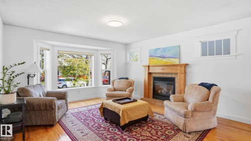 9611 77 Avenue, Edmonton, AB - Indoor Photo Showing Living Room With Fireplace