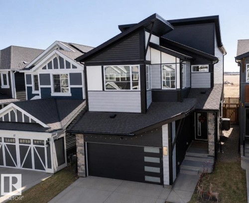 Modern two-story residence featuring a striking black and gray exterior with white trim - 19 Sturtz Place, Leduc, AB - Outdoor