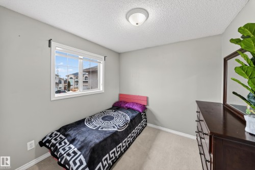 Room with light gray walls, a window providing natural light, and neutral-toned carpeting - 3517 25 Street, Edmonton, AB - Indoor Photo Showing Bedroom