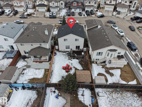 This property features a well-maintained exterior with a dark shingled roof and light-colored siding - 3517 25 Street, Edmonton, AB - Outdoor