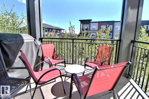 Private balcony with a concrete floor and black metal railing - 327 508 Griesbach Parade, Edmonton, AB - Outdoor With Balcony With Exterior