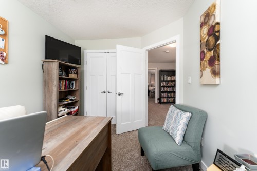Neutral-toned wall paint and carpeted flooring define this interior space - 16805 55 Street, Edmonton, AB - Indoor Photo Showing Bathroom