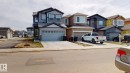The property features a two-story exterior with grey siding and a light-colored front door, complemented by a two-car garage - 607 31 Avenue, Edmonton, AB  - Outdoor With Facade 