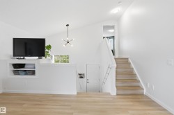 Vaulted ceiling interior featuring light wood-finish flooring - 