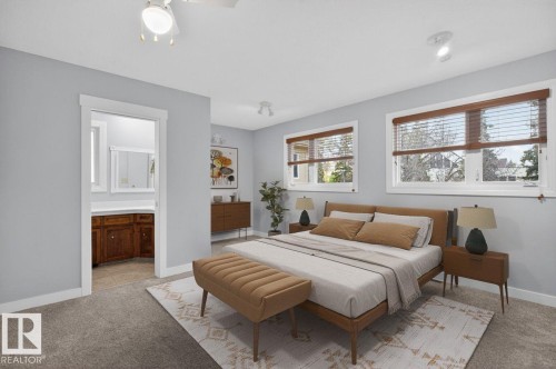 Carpeted sleeping area with light blue walls and white trim - 8911 84 Avenue, Edmonton, AB - Indoor Photo Showing Bedroom