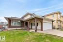 Brick and stucco exterior with an integrated single-stall garage - 8911 84 Avenue, Edmonton, AB  - Outdoor 