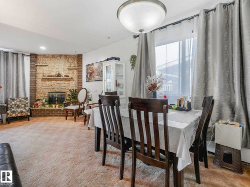 8715 41 Avenue, Edmonton, AB - Indoor Photo Showing Dining Room With Fireplace