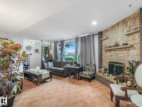 8715 41 Avenue, Edmonton, AB - Indoor Photo Showing Living Room With Fireplace