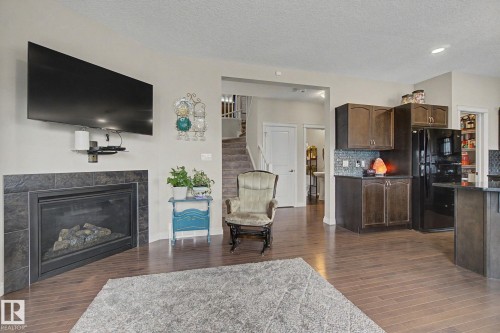 82 Dalquist Bay, Leduc, AB - Indoor Photo Showing Living Room With Fireplace