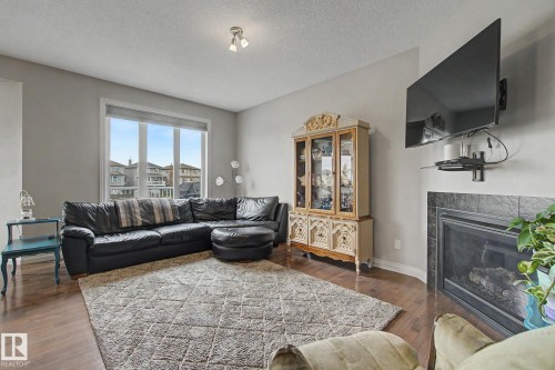 82 Dalquist Bay, Leduc, AB - Indoor Photo Showing Living Room With Fireplace