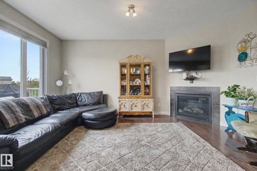 82 Dalquist Bay, Leduc, AB - Indoor Photo Showing Living Room With Fireplace