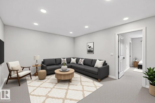 Spacious living area featuring light gray walls, recessed lighting, and soft gray carpeting - 332 Juniper Cove, Leduc, AB - Indoor
