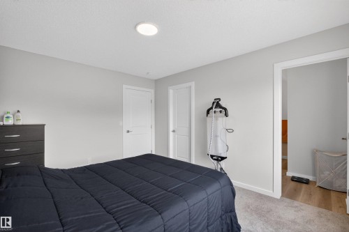 Bedroom featuring light gray walls, white trim, and a recessed ceiling light - 332 Juniper Cove, Leduc, AB - Indoor Photo Showing Bedroom