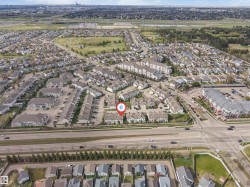 Aerial perspective showcasing a residential community with varied housing types - 