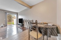 Open-concept living area featuring a sliding glass door providing direct outdoor access - 