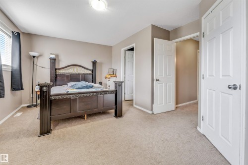 Spacious room featuring neutral carpeting and wall tones - 135 150 Edwards Drive, Edmonton, AB - Indoor Photo Showing Bedroom