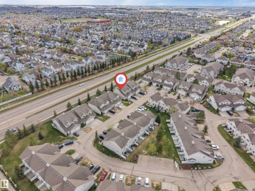 Aerial perspective showcasing a residential community with numerous detached and attached properties - 135 150 Edwards Drive, Edmonton, AB - 