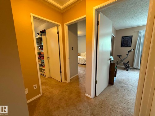 Hallway with carpeting and neutral-toned walls - 2812 35 Street, Edmonton, AB - Indoor Photo Showing Other Room