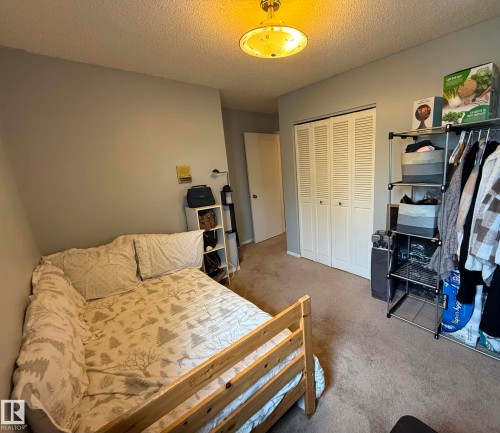Room featuring light gray painted walls and neutral-toned carpeting - 2812 35 Street, Edmonton, AB - Indoor Photo Showing Bedroom