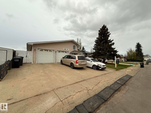 Two-car attached garage with individual white doors - 2812 35 Street, Edmonton, AB - Outdoor