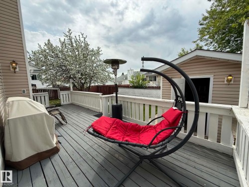 Expansive outdoor deck featuring wood flooring and white railing - 2812 35 Street, Edmonton, AB - Outdoor With Deck Patio Veranda With Exterior