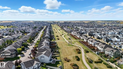 Expansive aerial perspective showcasing a residential development with numerous single-family homes - 1590 Chapman Way, Edmonton, AB 