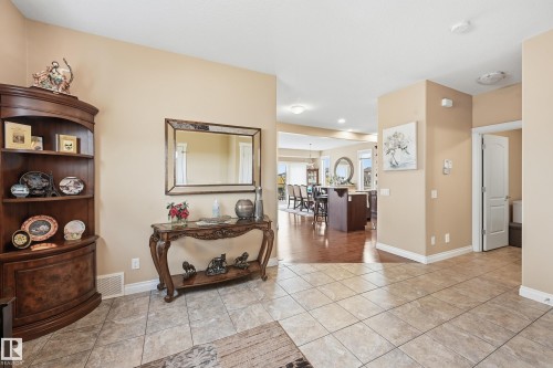 Tiled entryway featuring neutral wall tones, white baseboards, and overhead lighting - 1590 Chapman Way, Edmonton, AB 