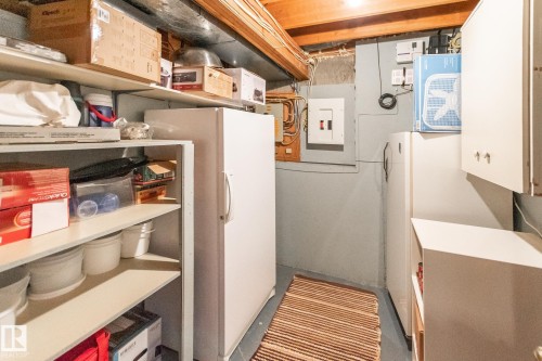 Utility space featuring exposed wood ceiling joists and concrete walls - 4611 Lakeshore Drive, Bonnyville Town, AB - Indoor