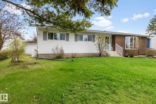 Ranch-style residence featuring a brick facade and white siding - 4611 Lakeshore Drive, Bonnyville Town, AB - Outdoor