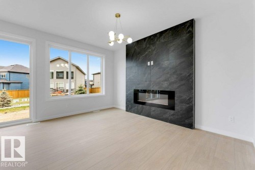 1623 Siskin Link Link, Edmonton, AB - Indoor Photo Showing Living Room With Fireplace
