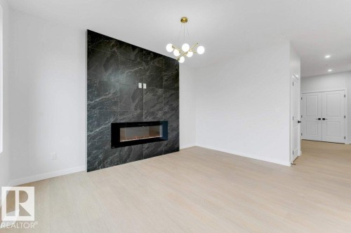 1623 Siskin Link Link, Edmonton, AB - Indoor Photo Showing Living Room With Fireplace