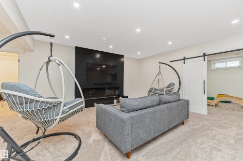 Spacious room featuring plush carpet flooring and recessed lighting - 627 Forest Lane, Edmonton, AB - Indoor