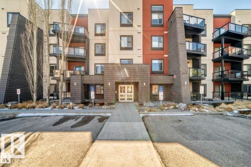 Modern multi-story building featuring a brick and panel exterior - 228 308 Ambleside Link Sw, Edmonton, AB - Outdoor With Balcony With Facade