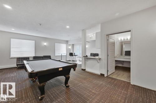Recreation room featuring a pool table, patterned carpet flooring, and recessed lighting - 228 308 Ambleside Link Sw, Edmonton, AB - Indoor Photo Showing Other Room