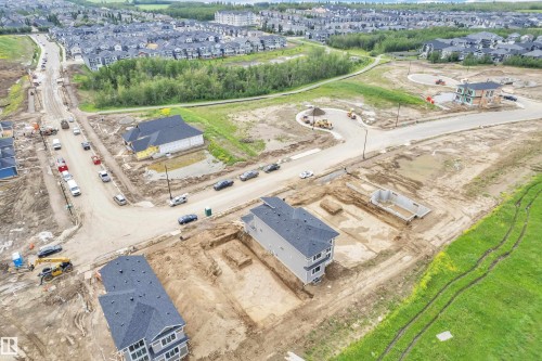 Developing residential area featuring multiple new construction homes and building sites - 1129 Starling Drive Nw, Edmonton, AB - Outdoor With View