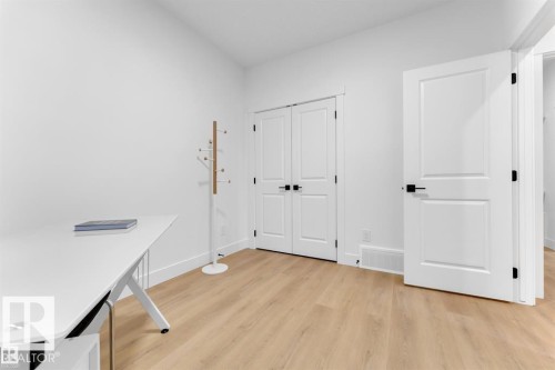 Bright interior space featuring light wood-finish flooring - 1129 Starling Drive, Edmonton, AB 