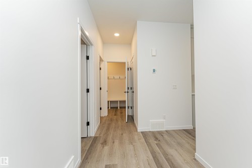 Entryway featuring light-toned flooring, white walls, and recessed lighting - 2355 Egret Way, Edmonton, AB - Indoor Photo Showing Other Room