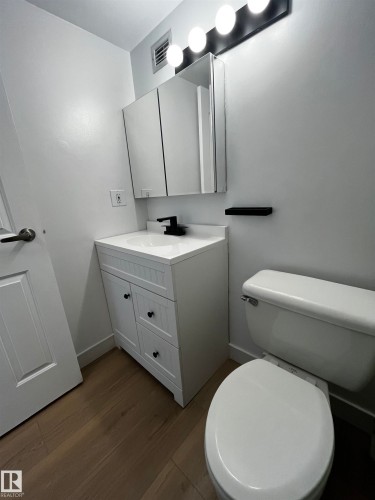 White shaker vanity with a white countertop and undermount sink - 807 10011 116 Street, Edmonton, AB - Indoor Photo Showing Bathroom