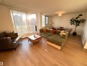 Open-concept living area with wood-finish flooring - 807 10011 116 Street, Edmonton, AB  - Indoor Photo Showing Living Room 